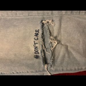 Ripped “Don’t Care” Jeans